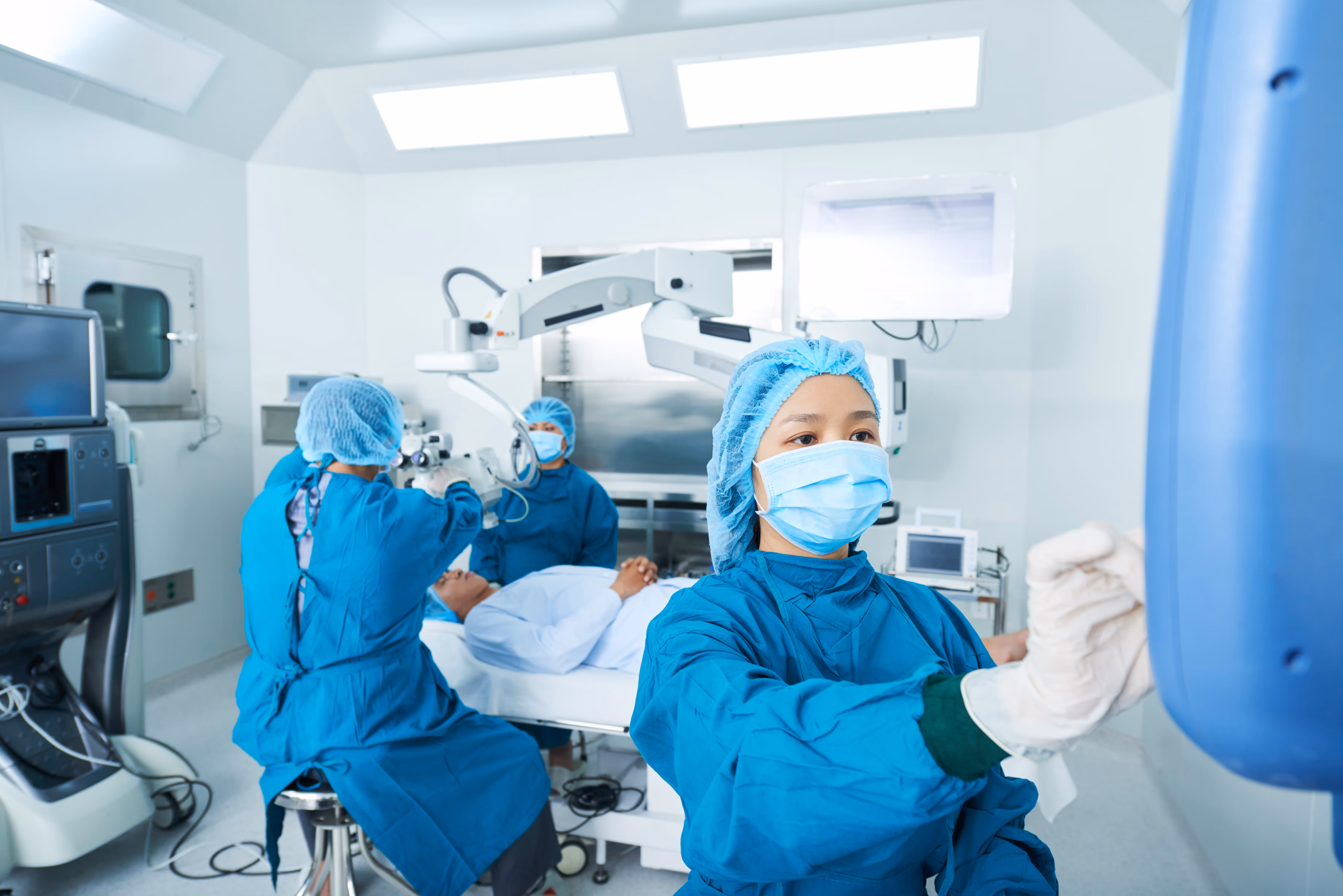 A team of doctors performing an operation in a surgery room