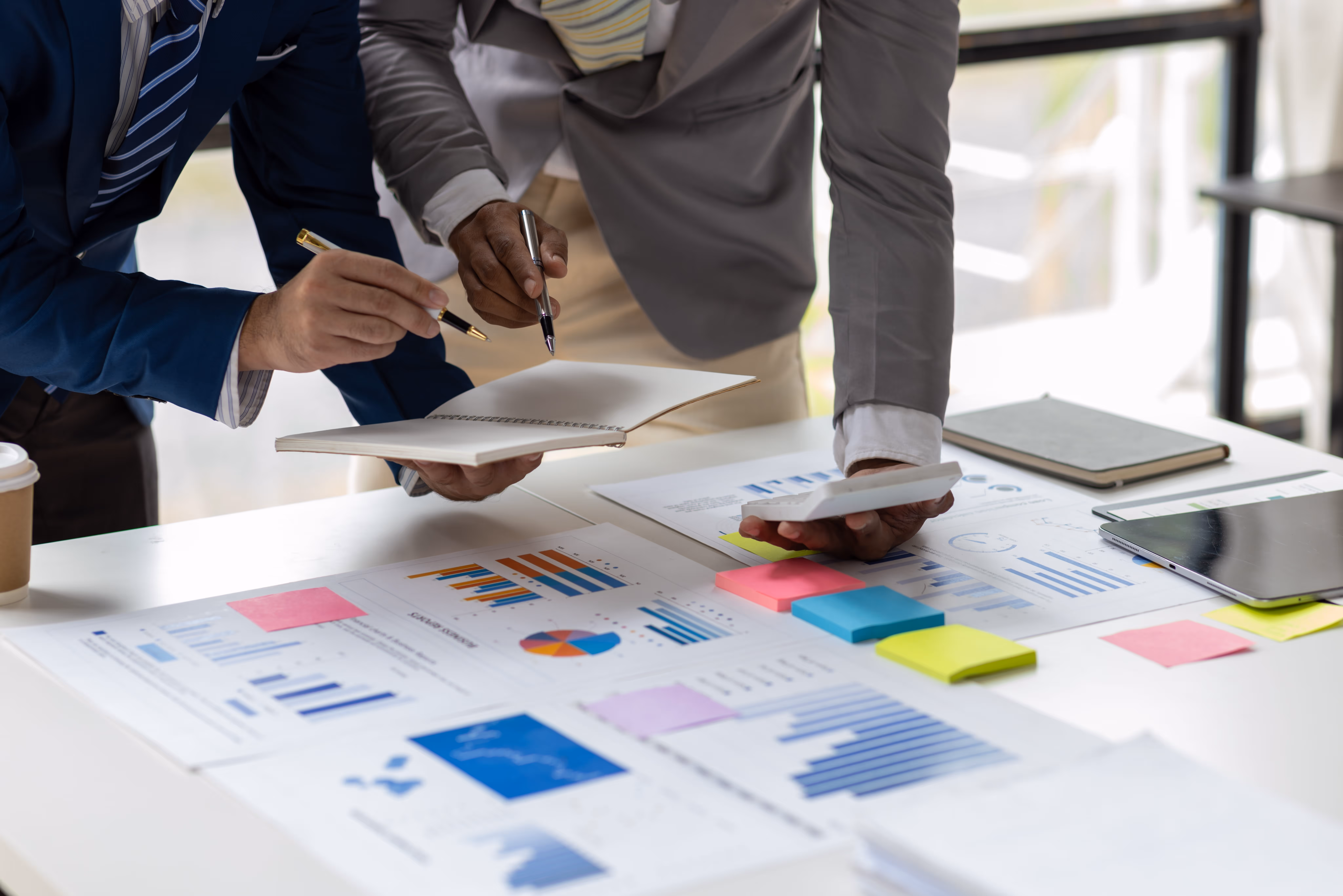 A team work looking over several charts